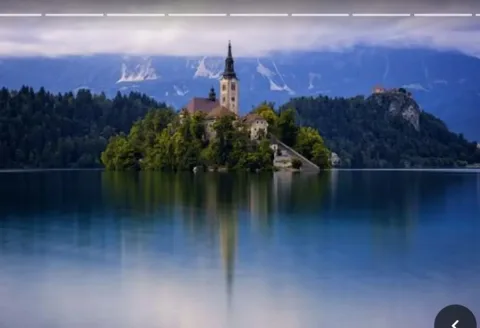 The island church on Lake Bled under a dark sky