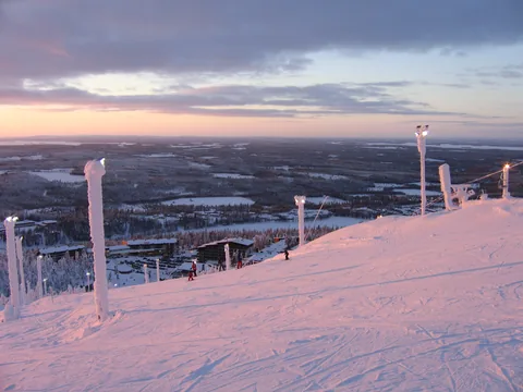 Pink dusk light across the pisted slopes at Ruka.